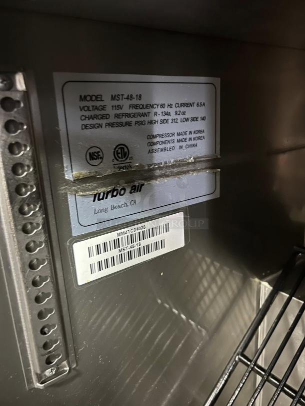 Turbo Air MST-48-N M3 Series 48" refrigerated sandwich prep table, great condition, tested, with labels showing specs and model info.