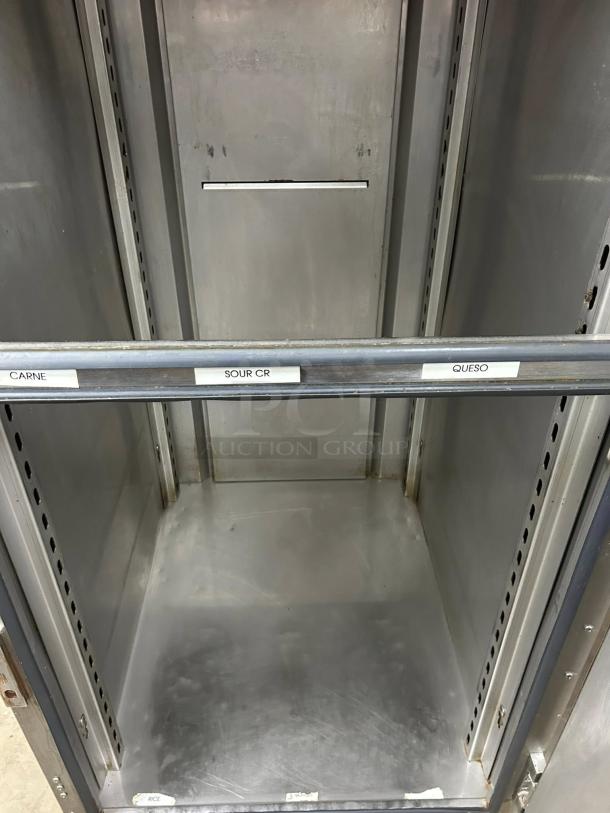 FWE UHST-12-OTB solid door mobile heated cabinet, 13 pan capacity, stainless steel interior with labeled shelves, tested working.