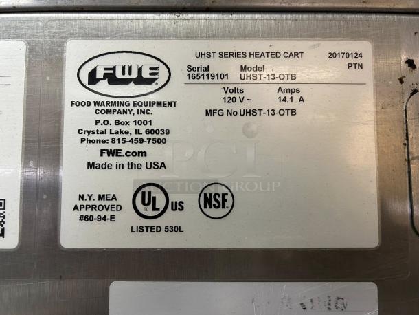 FWE UHST-12-OTB heated holding cabinet label, 120V, 14.1A, NSF certified, serial 165119101, made by Food Warming Equipment Co.
