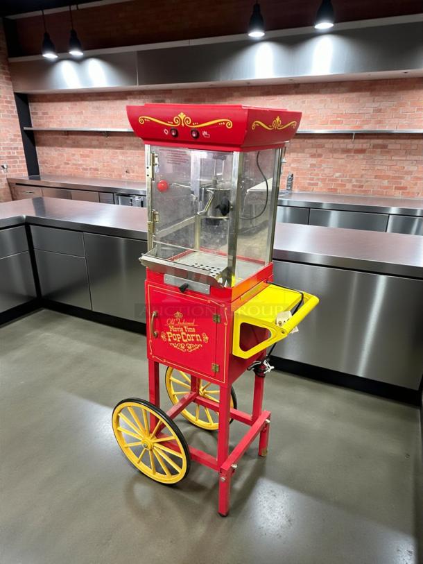 Nostalgia CCP-200 popcorn machine cart in red; freestanding model, tested working, features vintage design with oil tray.