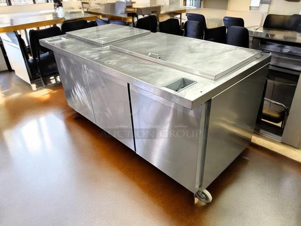 Continental SW72-N-18C 72" 3 Door Sandwich Prep Table, stainless steel, great condition, tested, wheels for mobility.