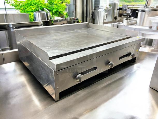 Stratus SMG36 36" gas griddle in great condition. Flat top grill, NSF certified, tested and working. Knob controls visible.