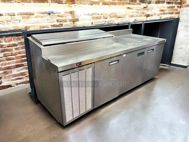 Delfield 000-20191PTC 91in 3-door refrigerated pizza prep on casters; stainless steel; tested, working condition.