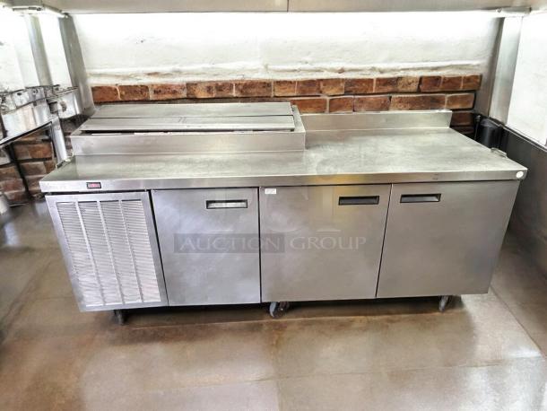 Delfield 000-20191PTC 91in 3-door refrigerated pizza prep, stainless steel, on casters, tested and working condition.