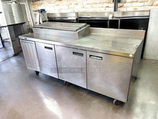 Delfield 000-20191PTC 91in 3-door refrigerated pizza prep table on casters, stainless steel, tested and working condition.