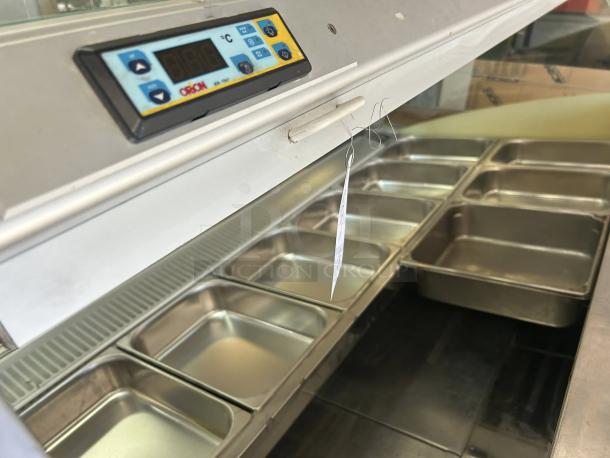 Oscartielle Model C83FK-9SC gelato case, 24 pans, digital controls visible, tested and working, great condition.