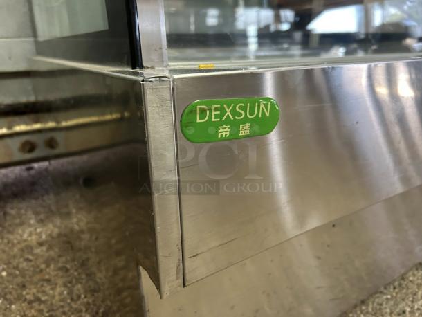 Dexson GD3890-1 60" refrigerated display case in excellent condition. Stainless steel with green Dexson label visible.