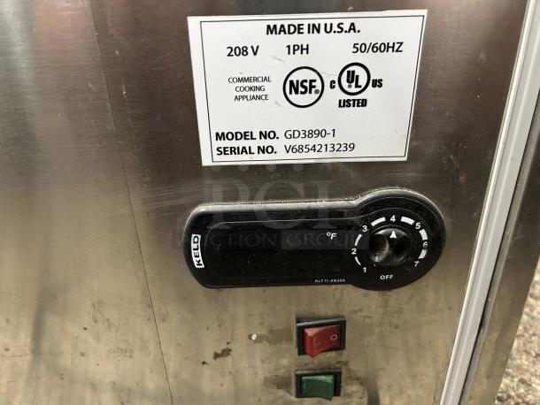 Dexson GD3890-1 unit with NSF and UL labels, voltage details, serial number V6854213239. Control dial and switches visible.