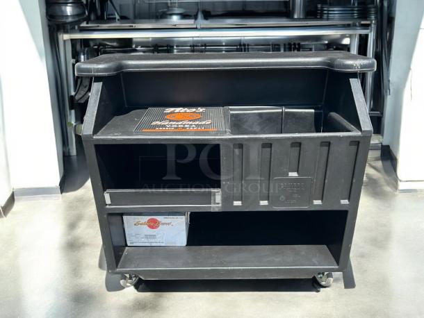 Cambro BAR540110 Cambar® black 54" portable bar in like new condition, with 5-bottle speed rail and smooth-rolling wheels.
