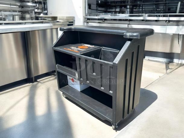 Cambro BAR540110 Cambar® black 54" portable bar with 5-bottle speed rail, like new condition, smooth-rolling wheels.