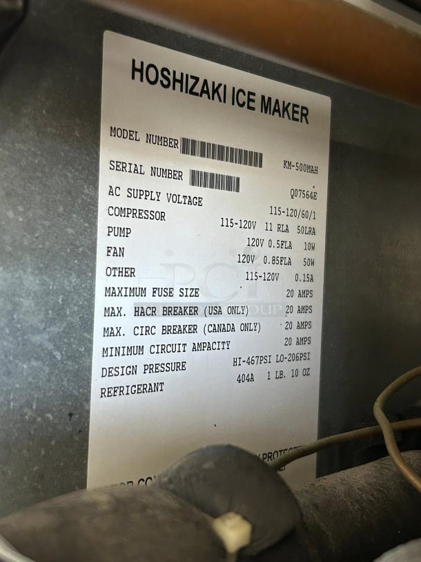 Hoshizaki Ice Maker label showing model KM-500MAH and serial Q07564E, voltage details, and refrigerant type 404A.