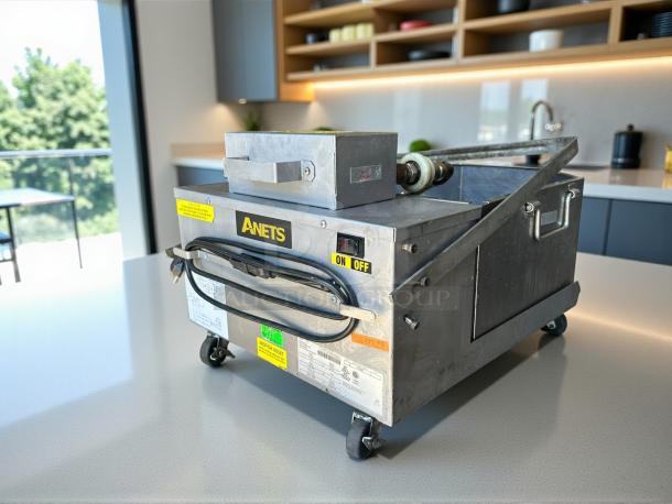 Anets FFM80 GoldenFry 80lb fryer filtration unit on casters, stainless steel, good condition, tested and working, with labeled controls.