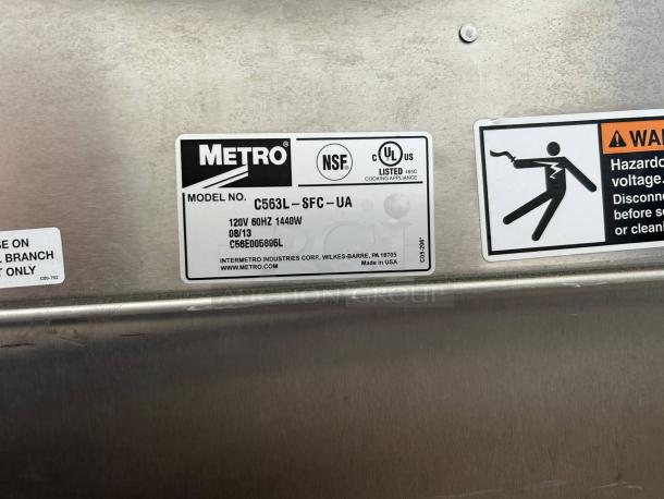 Metro C563L-SFC-L undercounter heated holding cabinet label, showing model, voltage, and safety warnings.