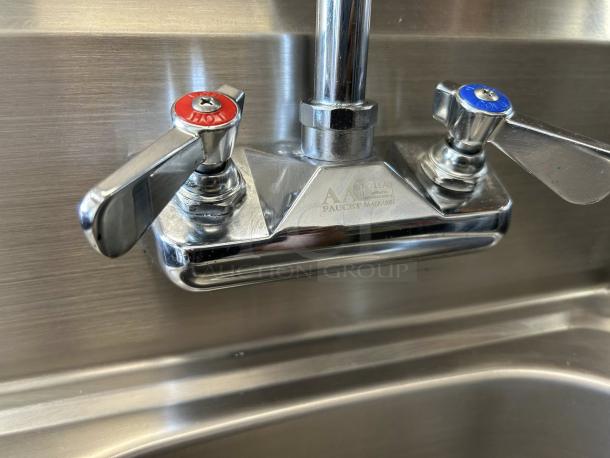 Like new AA Faucet HS-1615W stainless steel wall mount hand sink with 4" gooseneck faucet. Hot and cold handles visible.