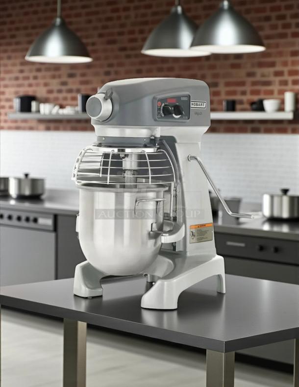 Hobart Legacy+ HL200 20 Qt. Planetary Stand Mixer with Guard, tested and working condition, 115v, on a kitchen counter.