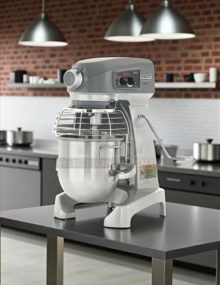Hobart Legacy+ HL200 20 Qt. Planetary Stand Mixer with Guard, tested and working condition, 115v, on a kitchen counter.