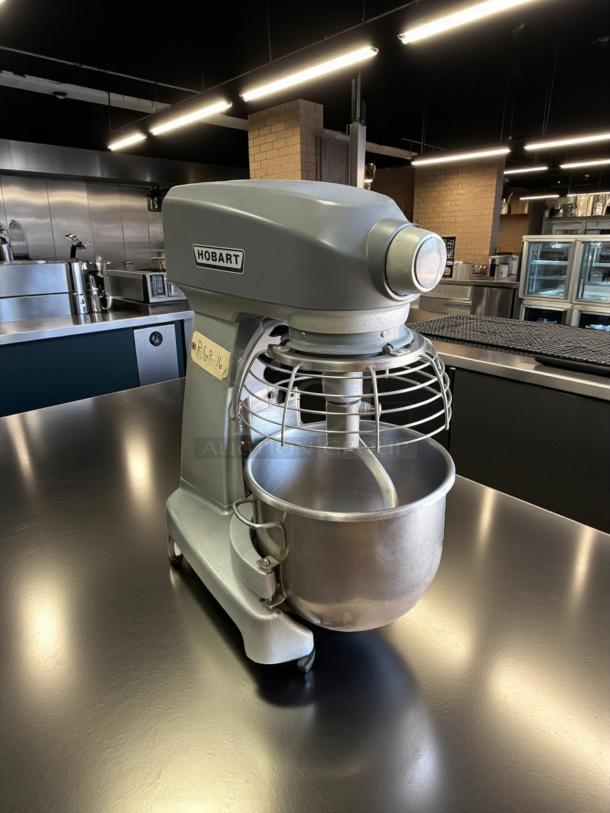 Hobart Legacy+ HL200 20 Qt. Planetary Stand Mixer with Guard, model HL200, tested and working, on a kitchen counter.