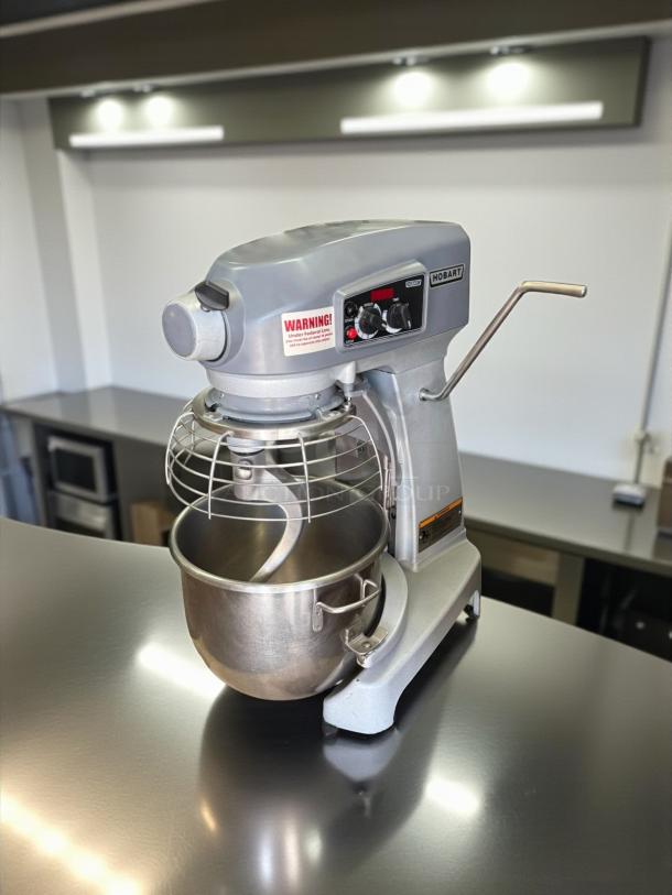 Hobart Legacy+ HL200 20 Qt. stand mixer with guard, tested and working. Features stainless steel bowl and control panel.