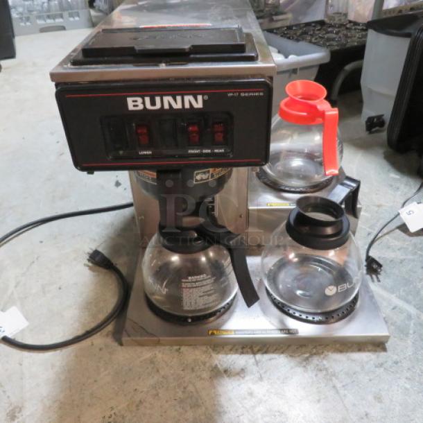 Bunn VP-17-3 coffee brewer with filter basket, two warmers, three glass pots. Model VP17-3, 120V, 16x18x18 inches.
