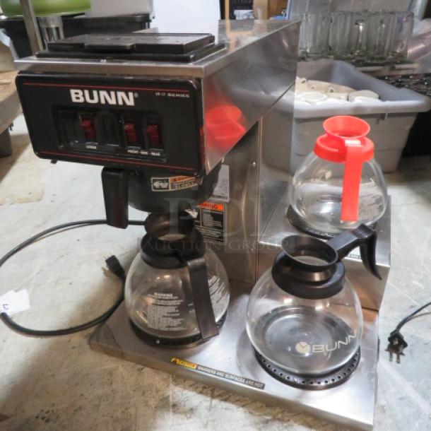 Bunn VP17-3 coffee brewer with filter basket, 2 warmers, and 3 glass pots. Model# VP17-3. 120V, dimensions 16"x18"x18".