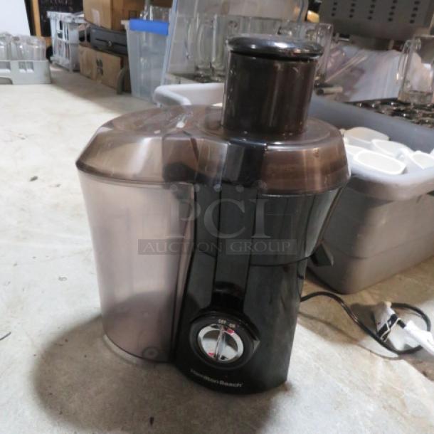 Hamilton Beach Juice Extractor, Model 67601A, 800W, 120V. Black with clear components. Appears in good condition.