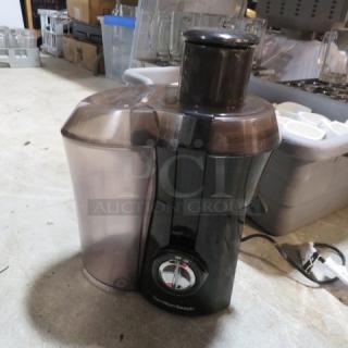 Hamilton Beach Juice Extractor, Model 67601A, 800W, 120V. Black with clear components. Appears in good condition.
