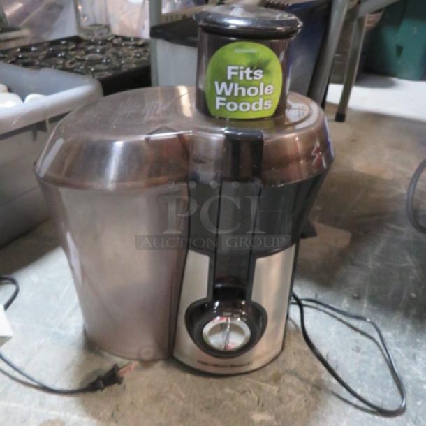 Hamilton Beach Juice Extractor, Model 67735, 120V, 800W, in used condition. Marked "Fits Whole Foods."