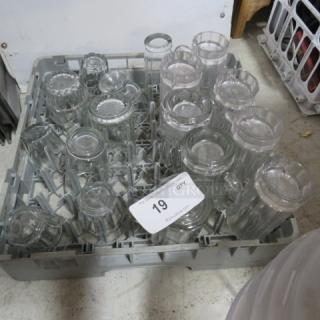 Dishwasher rack filled with assorted glassware, various sizes and styles, in good condition. Auction tag reads "19 QTY."