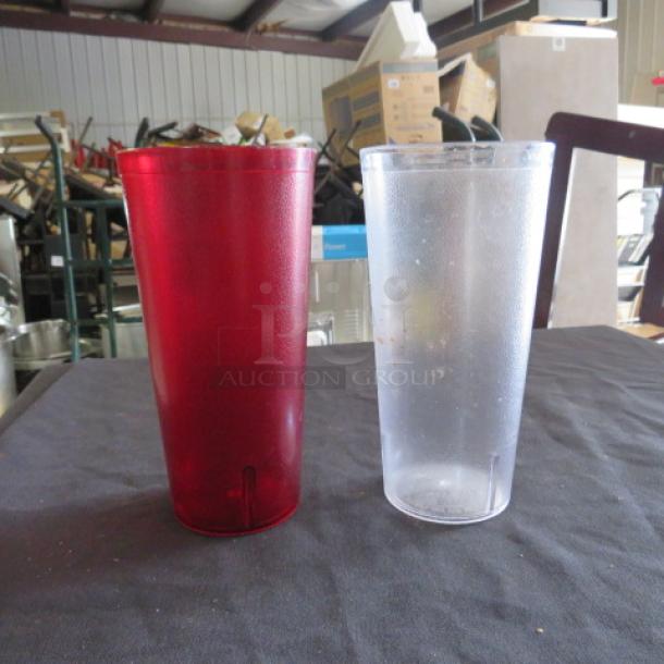 24oz red and clear poly glasses, durable; in good condition. Ideal for drinks. Sold as one mega lot.