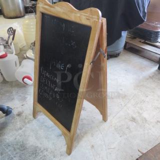 Wooden A-frame 16x32 sidewalk chalkboard sign, double-sided, lightly used, with visible chalk writing; ideal for businesses.