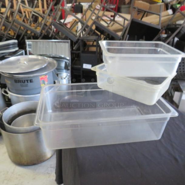 Assorted clear food storage containers in various sizes, plastic material, stackable design. Ideal for kitchen use.