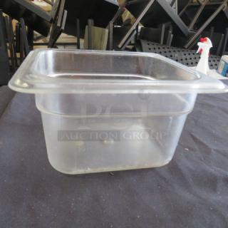 Clear 1/6 size, 4-inch deep food storage container, gently used condition, transparent with measurement markings.