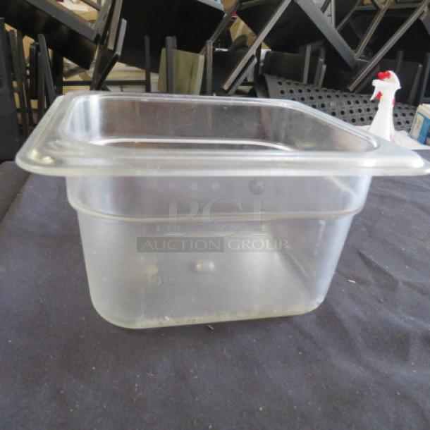 1/6 size, 4-inch deep clear food storage container, lightly used. Ideal for kitchen organization. Model: 10XBID.