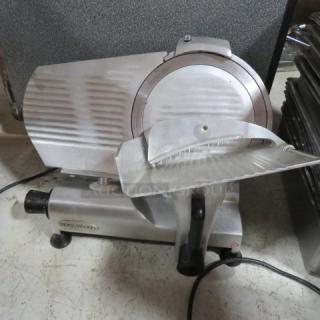 Servware 12-inch deli slicer, Model SLC-12. Features a stainless steel blade, 110V. Appears in good condition.