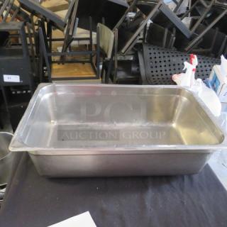 Stainless steel 6-inch deep hotel pan, full size. Slightly used condition, ideal for buffet or catering setups.