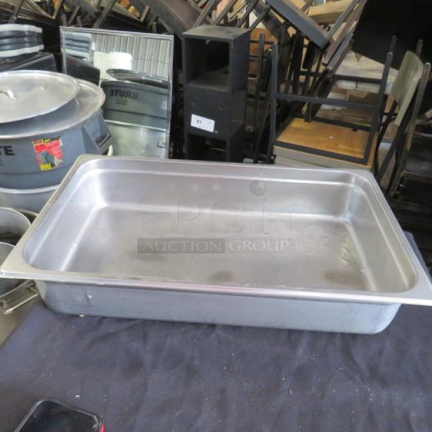 Full size 4-inch deep stainless steel hotel pan in used condition, with minor surface marks. Ideal for catering use.