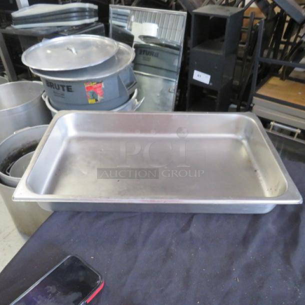 Full-size 2.5-inch deep hotel pan. Stainless steel, industrial use. Good condition, minor wear. Ideal for catering or restaurant use.