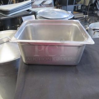 1/2 size 6-inch deep hotel pan, stainless steel, used condition, visible scratches, ideal for commercial kitchen use.