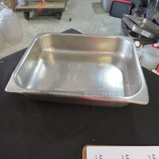 1/2 Size 2.5 Inch Deep Hotel Pan, stainless steel, good condition, no visible markings, ideal for food service use.