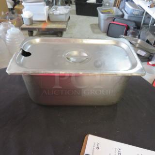 1/3 size, 6-inch deep hotel pan with lid, stainless steel, good condition, includes slot for utensil access.