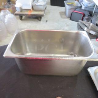 1/3 size, 6-inch deep stainless steel hotel pan, lightly used. Ideal for food service, durable and versatile kitchenware.
