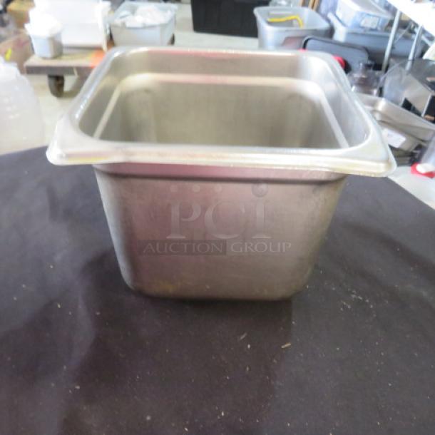 1/6 size 6-inch deep hotel pan, stainless steel, used condition, suitable for commercial kitchen use.