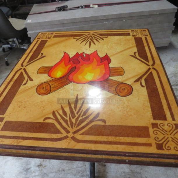 Custom wooden laminated table top on pedestal base, 42x36x30 inches, featuring a vibrant campfire design, excellent condition.