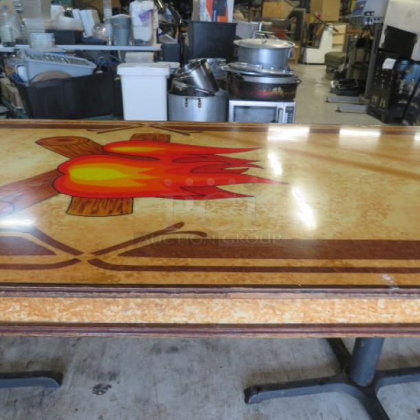Custom wooden laminated table top with campfire design on dual pedestal base, 96x36x30 inches, in good condition.