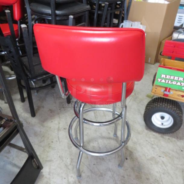 2 Ring Chrome Bar Stool with Red Swivel Seat and Back, featuring cushioned upholstery, excellent condition, 2XBID model.
