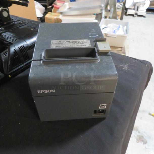 Epson M267A thermal printer, used condition, with visible power and connectivity ports. Model and brand labels intact.