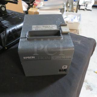 Epson M267A thermal printer, used, showing exterior condition. Label on top indicates technical details.