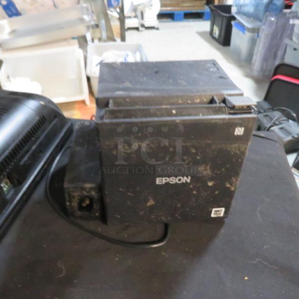 Epson M362B thermal printer, visible wear, black, power cable attached, Epson branding on front.