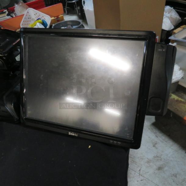 SAM4S SPT4740 15" touchscreen terminal, used condition, visible smudges on screen, black frame, model label on front.