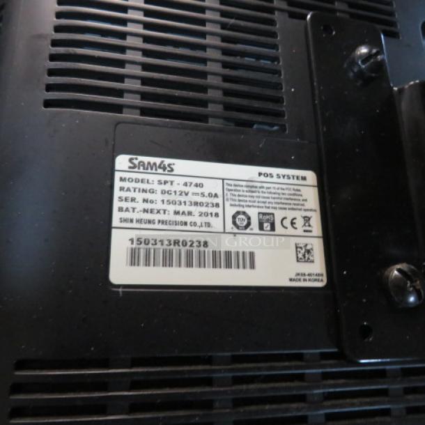 SAM4S SPT-4740 15-inch touchscreen terminal with serial number 150313R0238. Label indicates POS system, DC12V, 5.0A.
